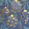 Blue and gold Christmas ornaments on a dark blue background with fir branches